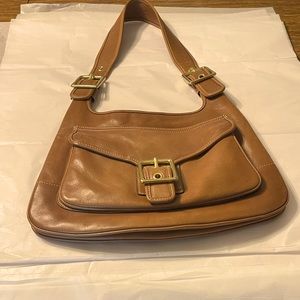 Coach brand Warm brown purse with gold colored buckles
